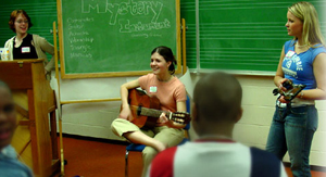 Students playing guitar and piano as part of Arts Immersion Day