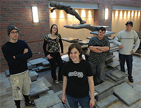 Picture of students with sculpture