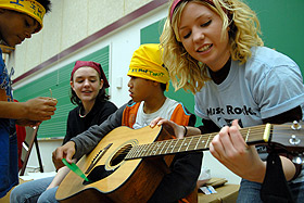 Picture of students playing guitar