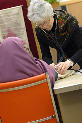 Picture of nurse checking blood pressure