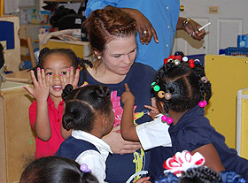 Picture of student with children