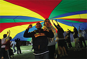 Picture of students under parachute