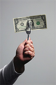 Picture of hand holding dollar bill on fork